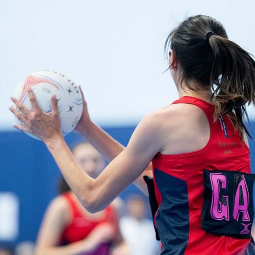 HKCC Netball Senior League player catches ball